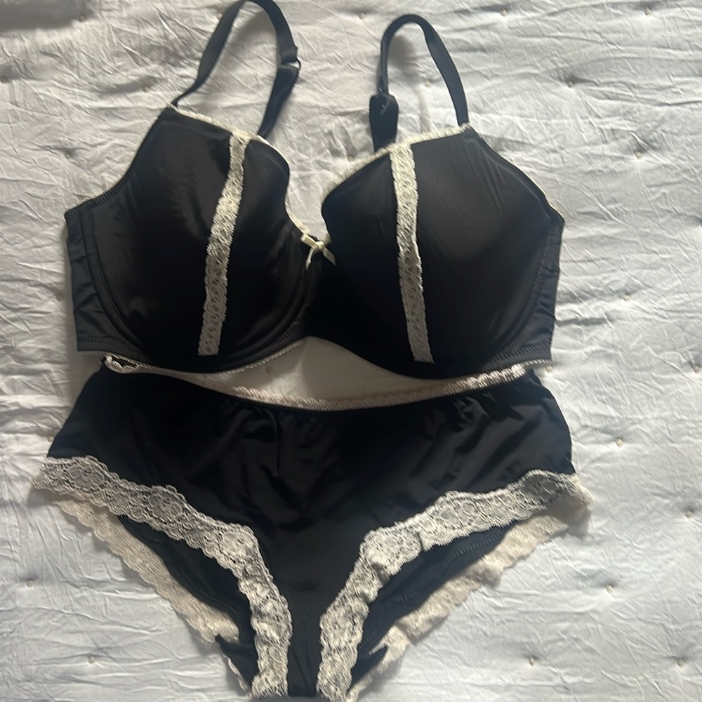 Bra and panty set black with ivory lace. Size 36DD and M